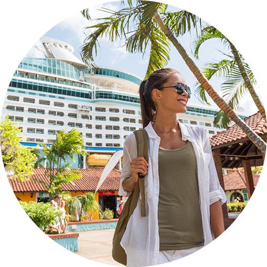 Happy traveller with a cruise ship in the background